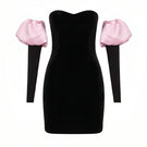 Nur Karaata Isadora Mini Dress displayed on a hanger, showcasing a stylish short dress with a fitted silhouette and trendy design.