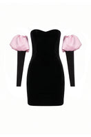 Nur Karaata Isadora Mini Dress displayed on a hanger, showcasing a stylish short dress with a fitted silhouette and trendy design.