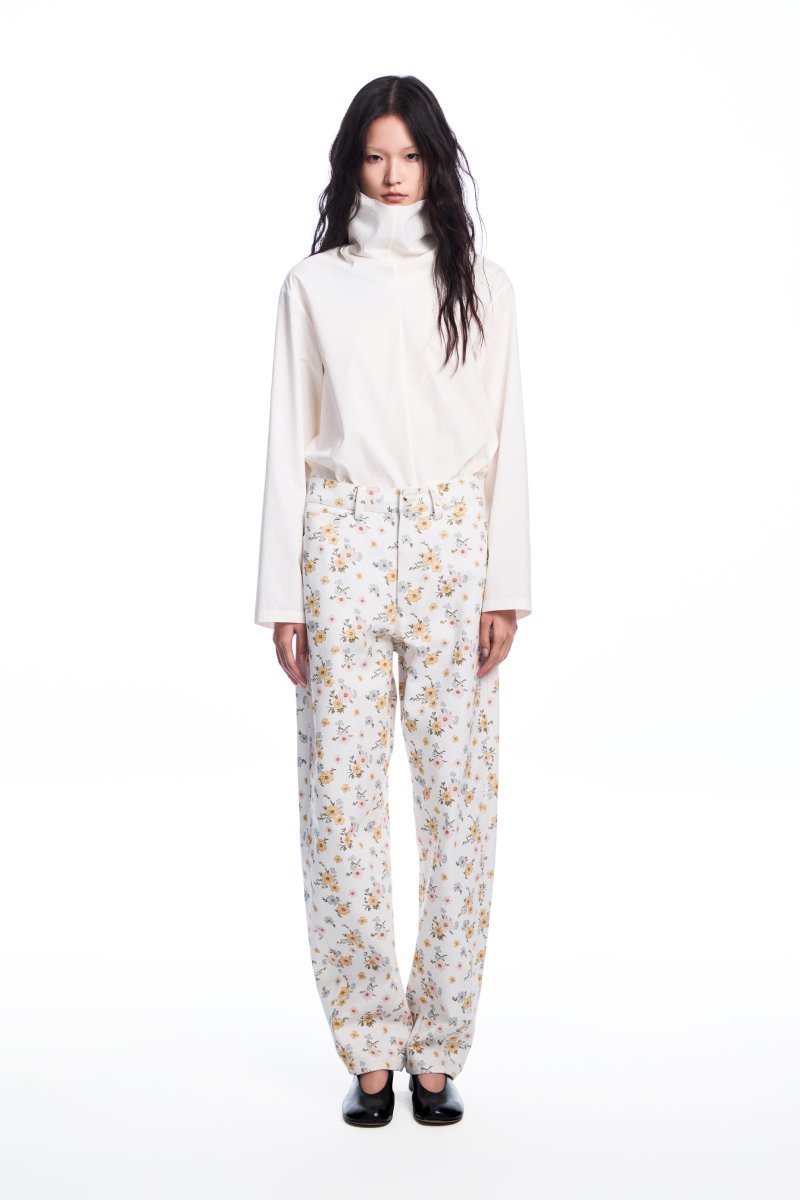 Chictopia floral jeans with colorful floral embroidery, slim fit design, and classic denim texture.