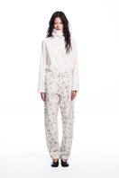 Chictopia floral jeans with colorful floral embroidery, slim fit design, and classic denim texture.