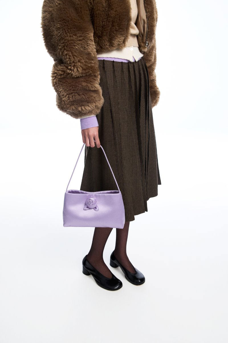 Chictopia lilac silk top handle bag with a structured design, featuring a sleek handle and elegant finish.