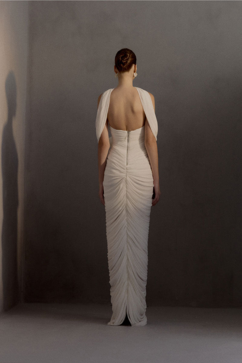 White Plan Sedley Dress gown featuring a flowing fabric, elegant design, and a fitted waist on a mannequin.