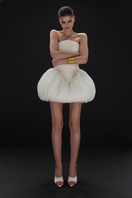 BalYKINA Clara Ivory Dress, mini dress with elegant design, showcased on a model with flowing fabric and stylish details.