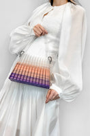 Touchless CULT MIA X handwoven purple and pink ombre pleated top handle handbag with sleek design and stylish appearance.