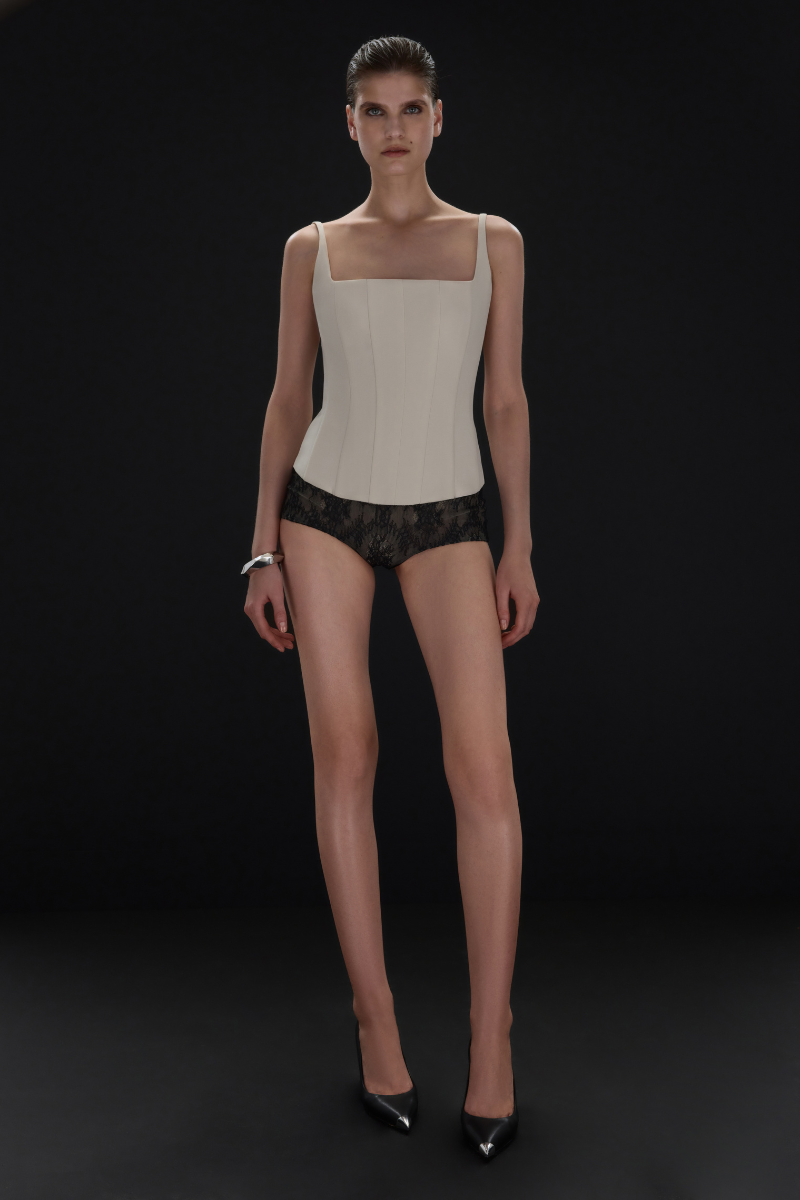 Beige matte silk corset top with straps from BALYKINA, showing the fitted design and smooth fabric texture.
