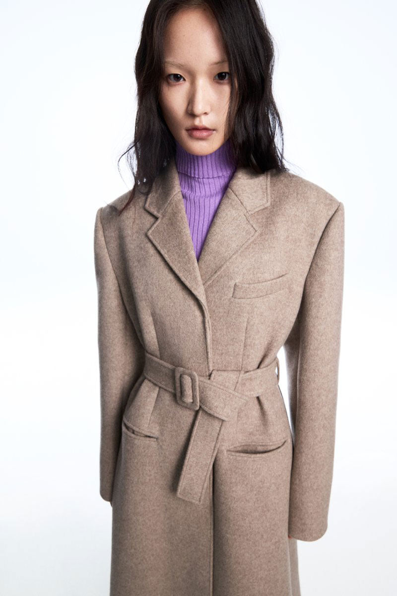 Chictopia ribbed knit lilac bodysuit, close-up of fitted shirt with ribbed texture and long sleeves on a white background.