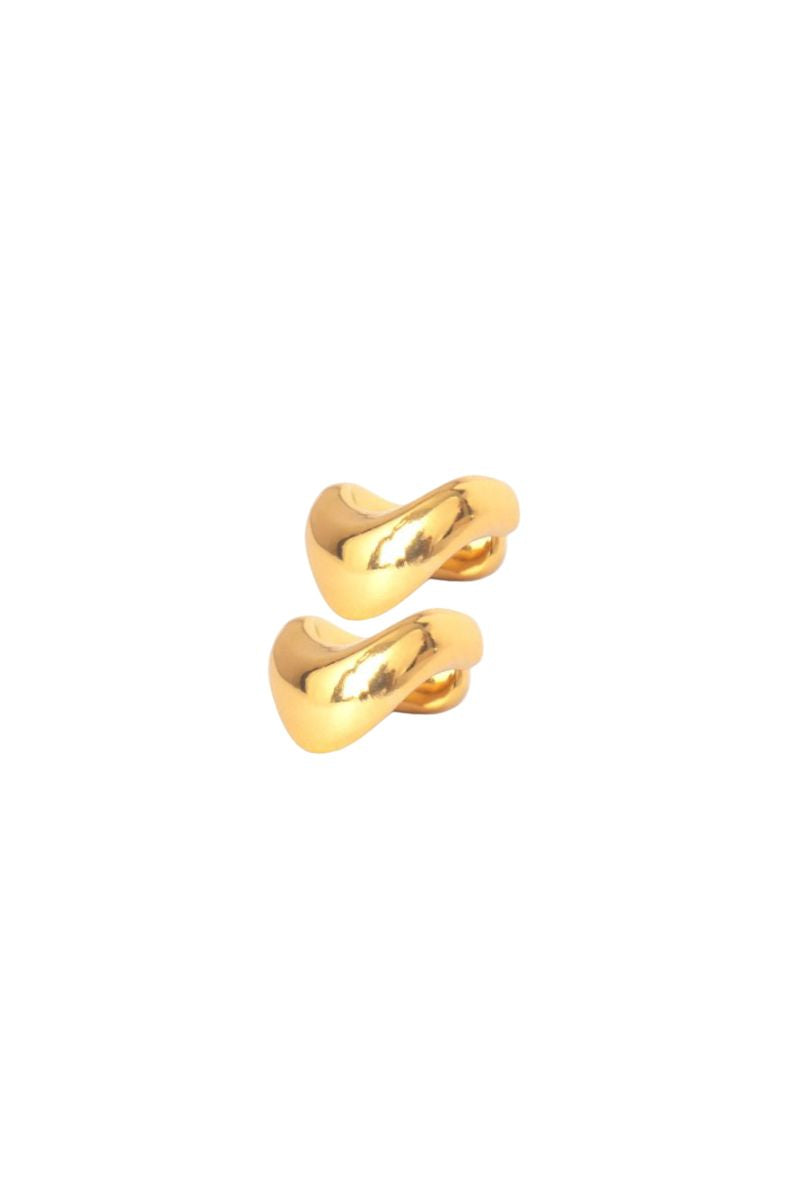 Golden Eugenia Ospina Resplandor Ear Cuff earrings in a 2-pack, shown on a model's ear, stylish and modern jewelry accessory.