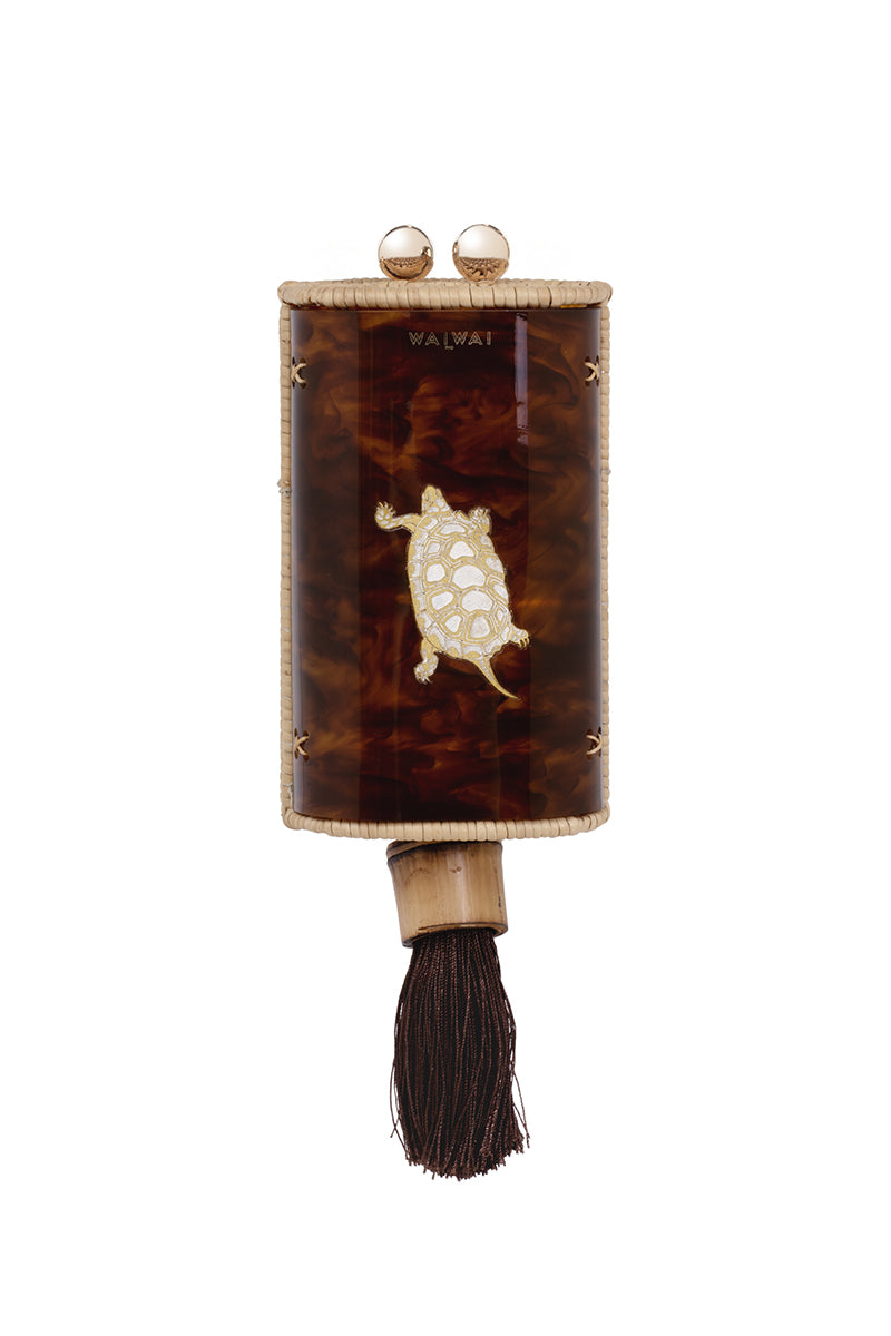 Waiwai Rio Cantil Turtle Shoulder Bag in natural woven material with turtle design, featuring a shoulder strap and spacious interior.