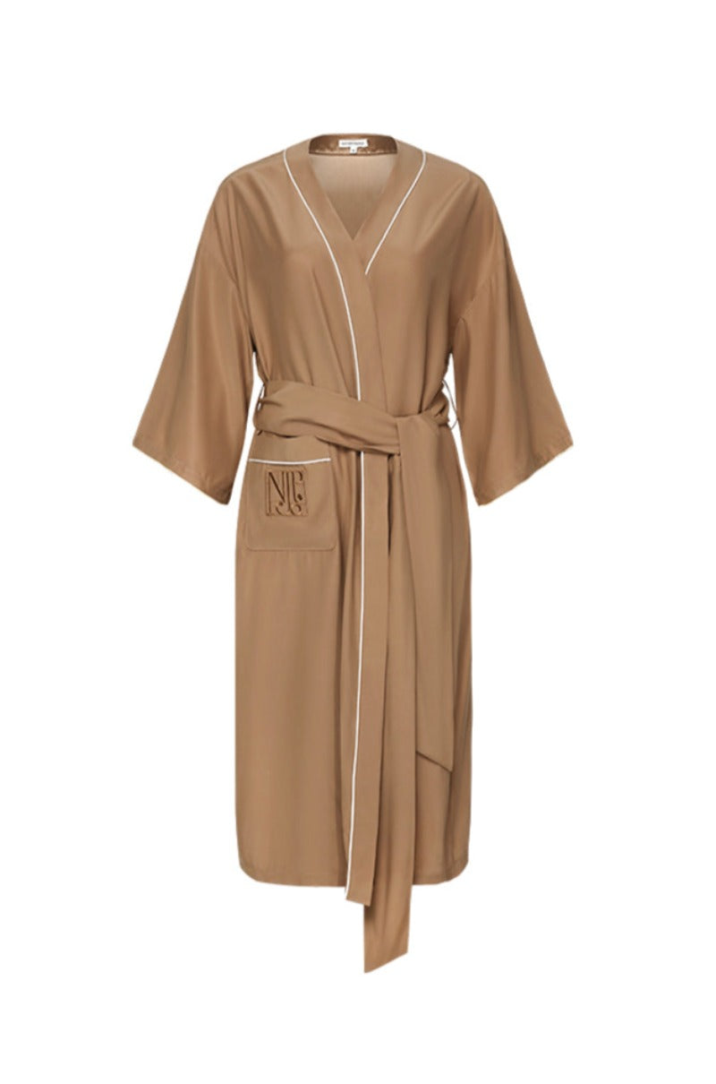 Soft water-hydrated silk robe from Not Just Pajama, featuring luxurious fabric and relaxed fit, displayed on a hanger.