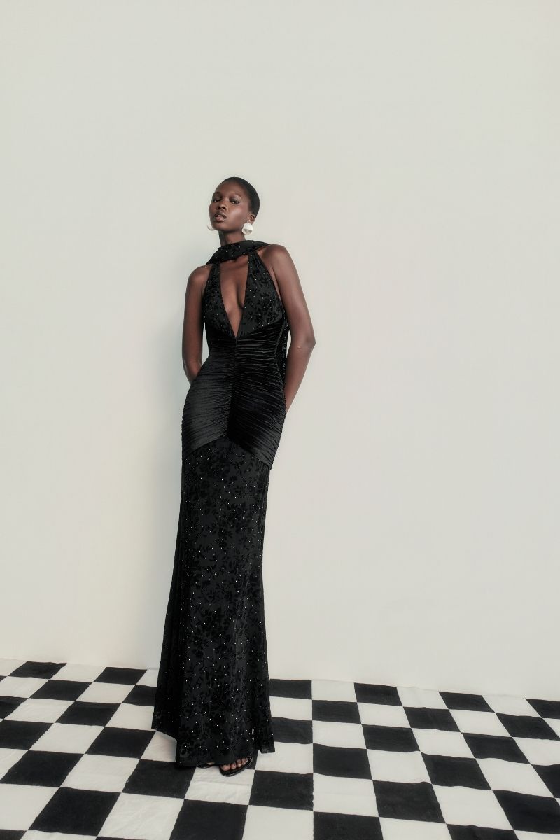 Black KAYLIN maxi dress by Khanum's featuring a flowing silhouette and elegant design, displayed on a mannequin.