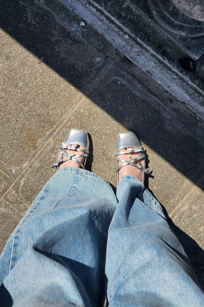 Christin Wu Annaya flats in silver, stylish slip-on shoes with a sleek, pointed toe and metallic finish, perfect for casual or dressy wear.