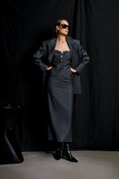 Gray striped Stardust pencil midi skirt by Acaria Studio displayed on a hanger with a plain background.
