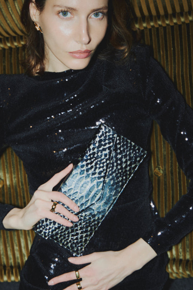 Vikele Studio Opera clutch in Python with sleek design and textured leather, perfect for elegant evening accessories.