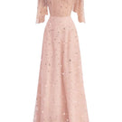 Pink crystal-embellished mesh maxi gown by Happy Clothing, featuring intricate beadwork and flowing fabric.