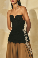 L'SCARLETT off-shoulder fringe jacquard and chiffon flared gown with intricate patterns and flowing design.