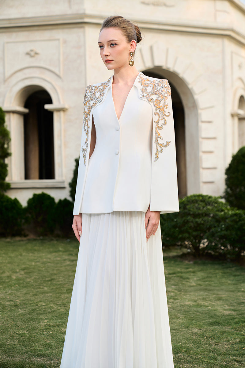 Tracy Studio velvet satin and chiffon gown co-ords set displayed on a hanger with intricate fabric details.