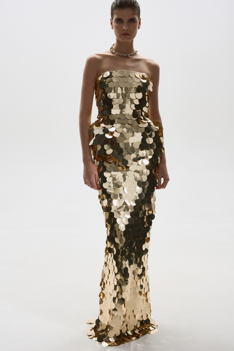 Gold sequin maxi skirt by Balykina, flowing design with shimmering sequins, elegant length, perfect for formal or festive occasions.