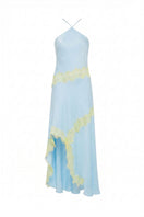 Summer Away ARAVA Maxi Dress displayed on a hanger with flowing fabric and vibrant pattern, perfect for summer wear.