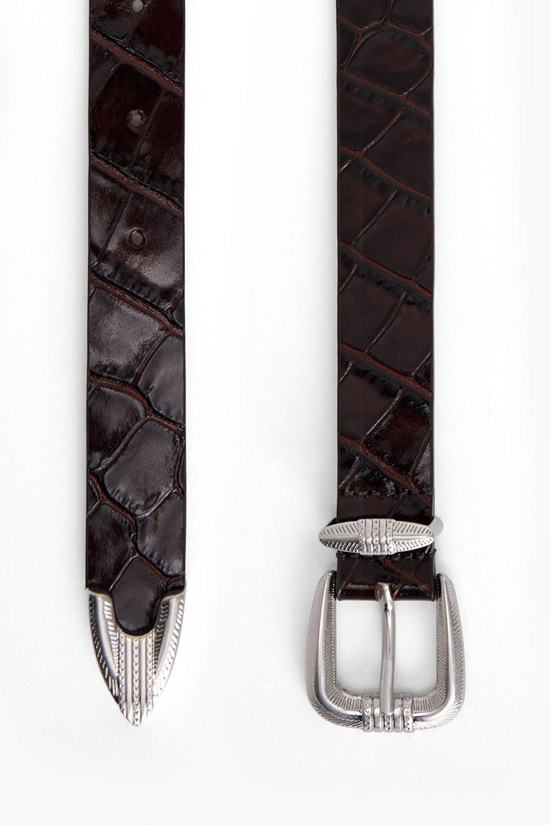 Maroon crocodile-embossed leather belt from Acaria Studio Victory collection, featuring a sleek design and silver buckle.