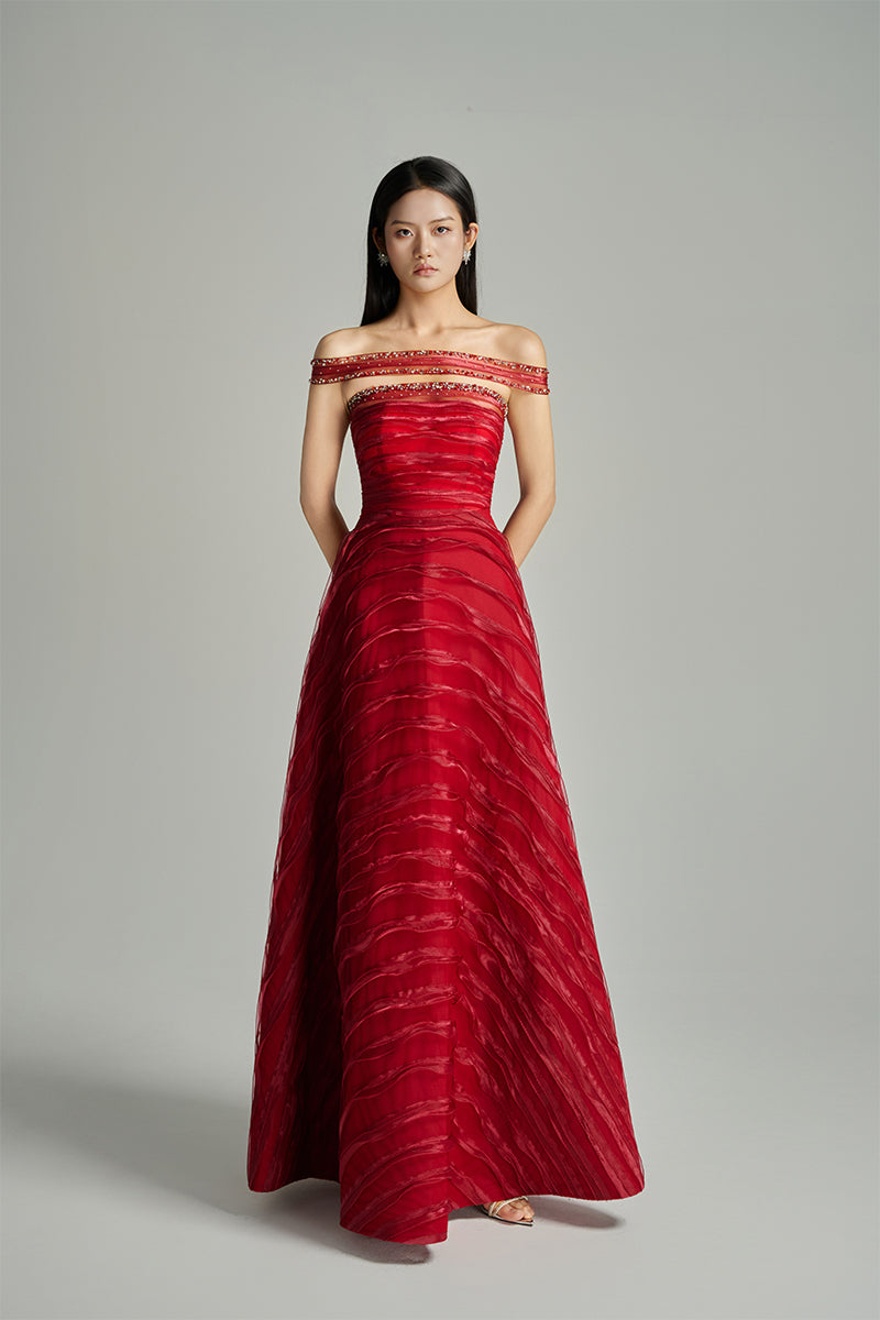 Red off-shoulder organza gown by HAPPY CLOTHING from the CULT MIA X HAPPY CLOTHING collection, featuring elegant draped fabric.