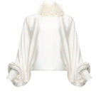 Beige Vaska feather-embellished blouse with long sleeves, stylish shirt perfect for elegant casual or evening wear.