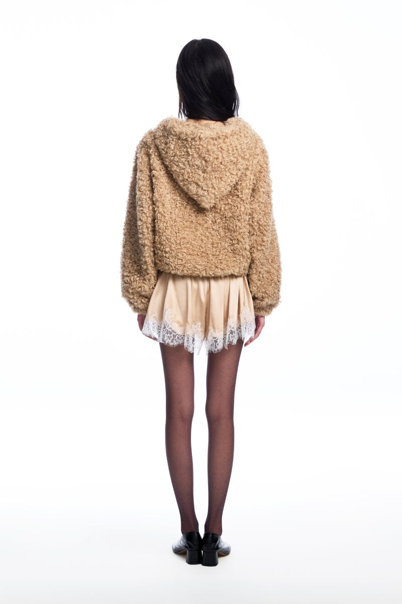 Chictopia tan teddy hoodie sweater with soft, plush fabric and cozy fit, displayed on a hanger against a neutral background.