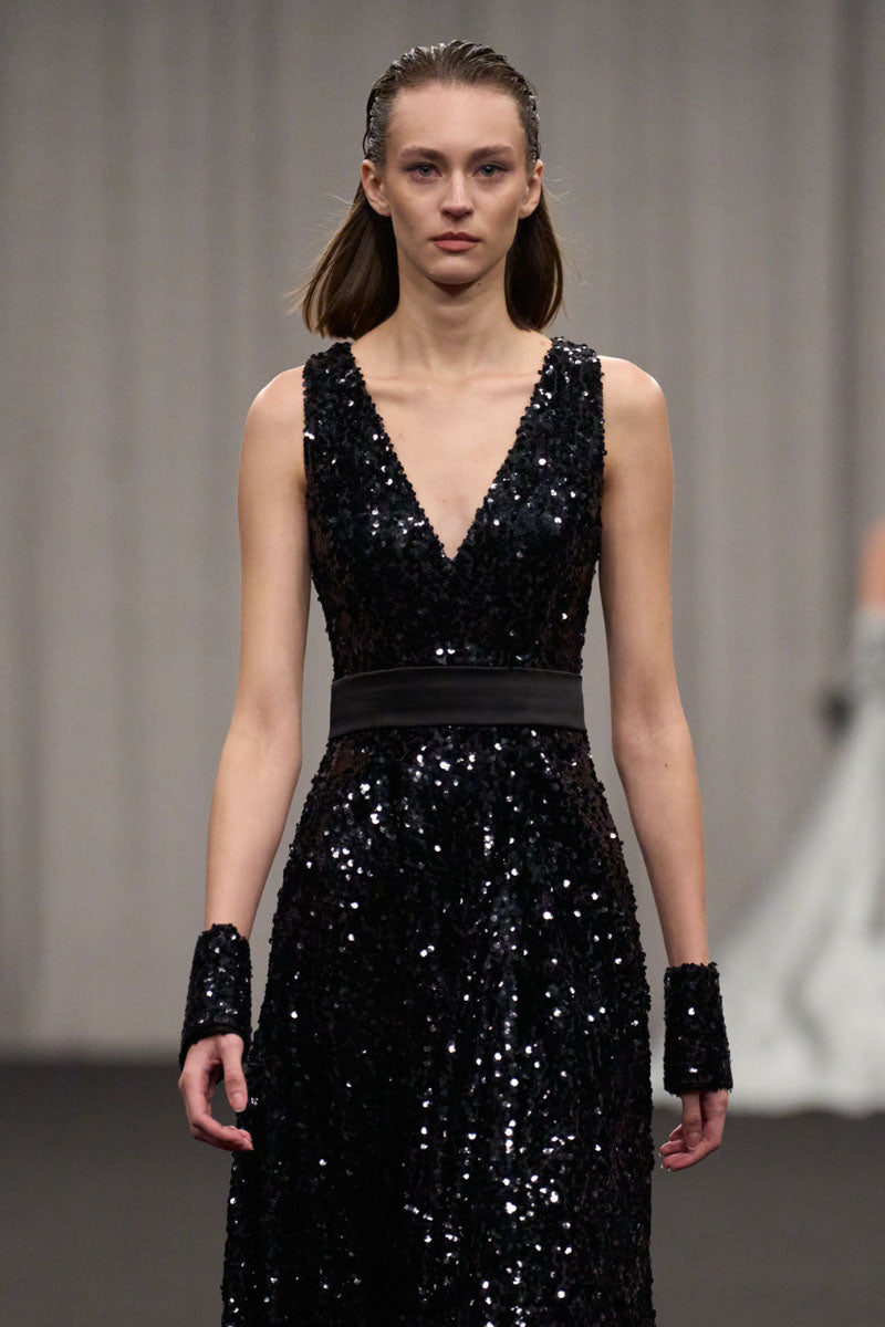Lili Blanc glamorous sleeveless sequin gown with fitted silhouette and elegant scoop neckline, adorned with shiny sequins.