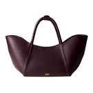 Rose de Mai Neroli Bag in Burgundy, a stylish top handle bag with smooth leather and elegant gold-tone hardware.