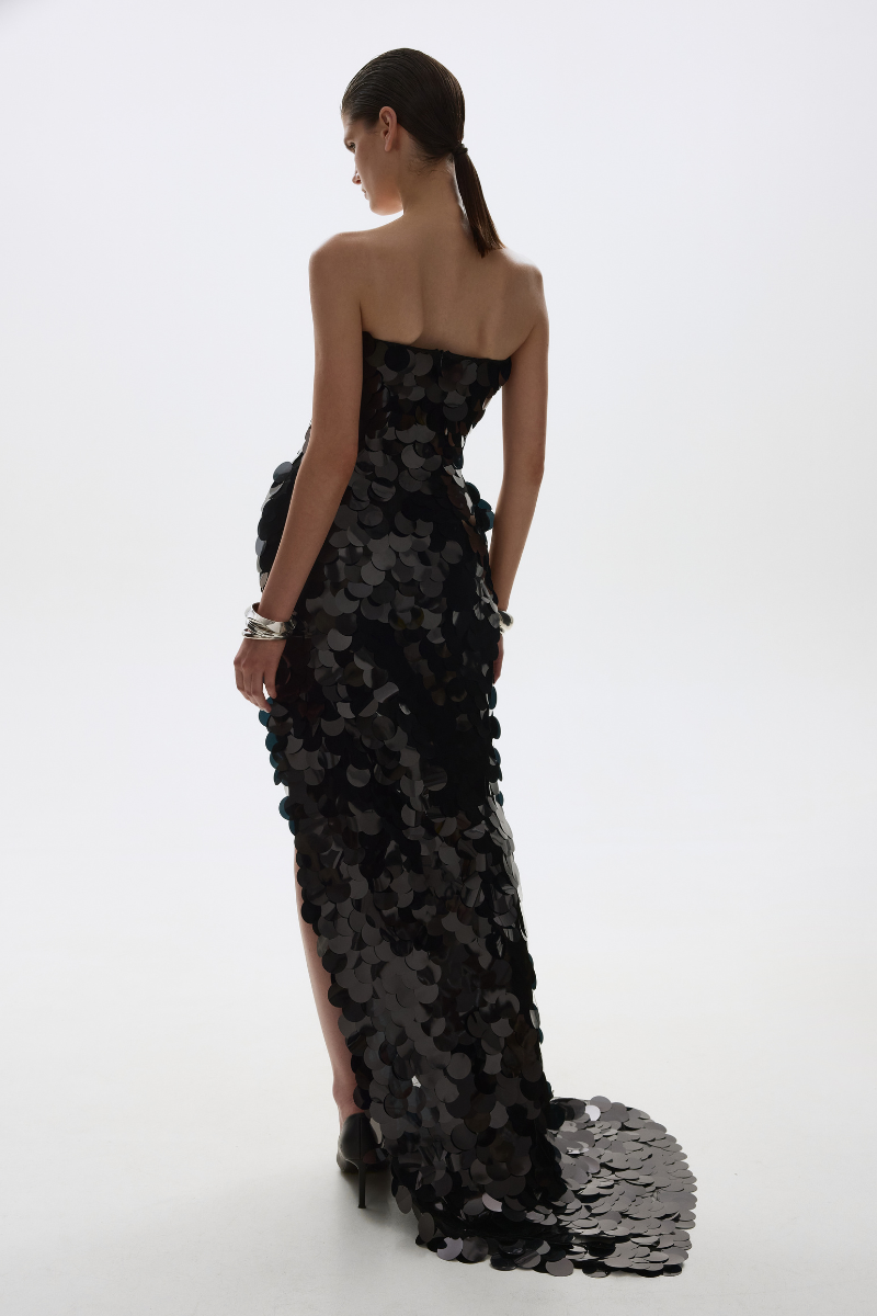 Black BALYKINA JULY gown featuring elegant fabric and a flowing silhouette, perfect for formal occasions.