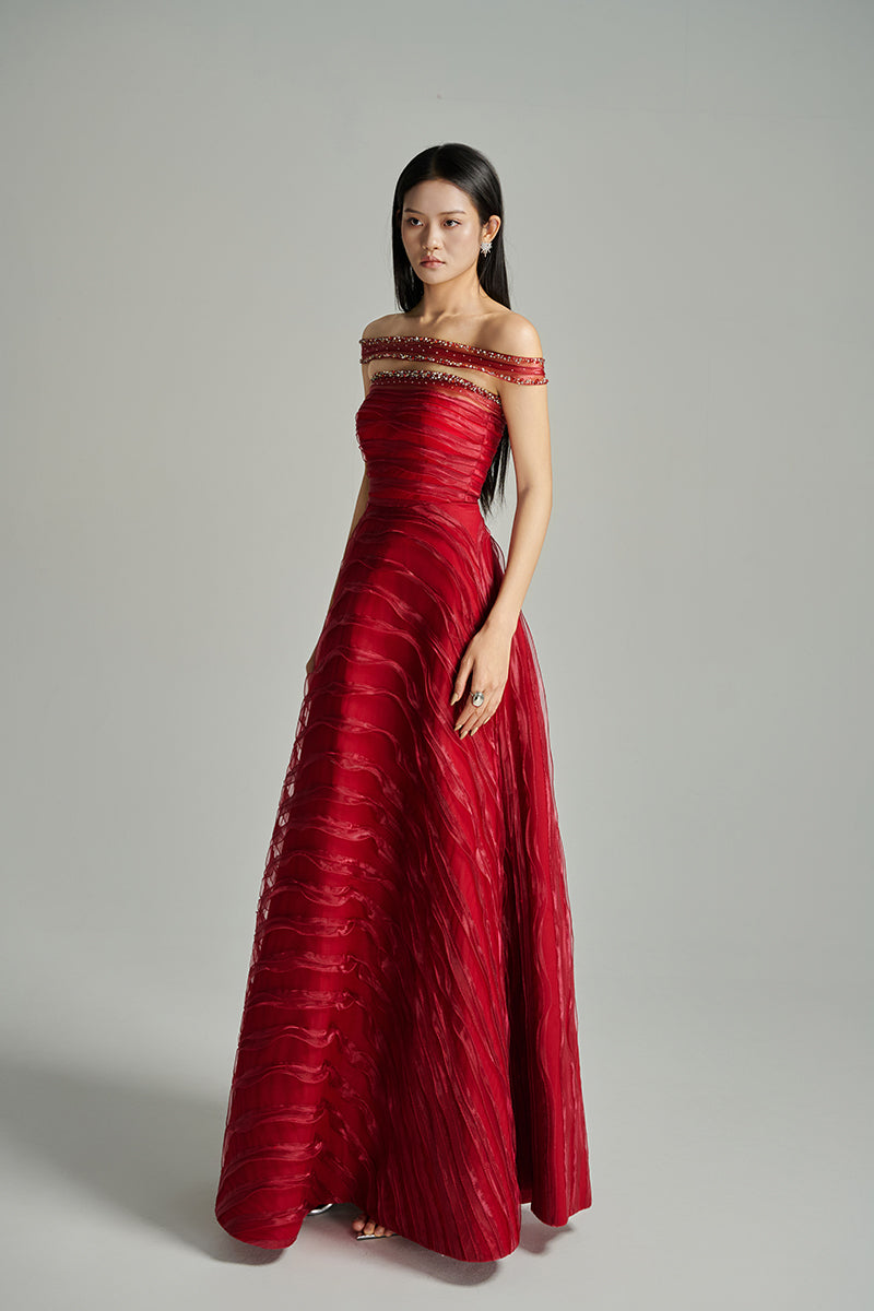 Red off-shoulder organza gown by Happy Clothing from the CULT MIA X collection, featuring elegant flowing fabric and stylish design.