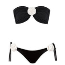 Nur Karaata Grace bikini with colorful floral pattern, triangle top and matching bikini bottoms on a neutral background.