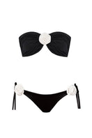 Nur Karaata Grace bikini with colorful floral pattern, triangle top and matching bikini bottoms on a neutral background.