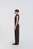 JINSUN FILANTE wool brown jumpsuit shown from the side, featuring long sleeves and a relaxed fit for casual or office wear.