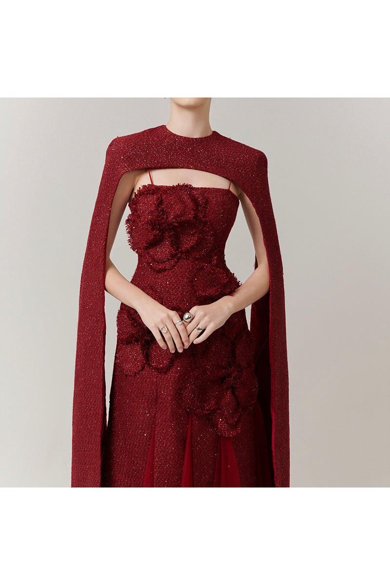 Red Preston Cape Tweed Petal Gown by Happy Clothing, showcasing its elegant design and textured tweed fabric.