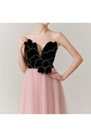 Elegant V-neck petal strapless gown by Happy Clothing, shown in a flowing design with floral petal accents.