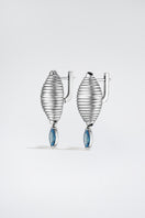 Silver Candy Earrings by Poché featuring colorful, playful candy-shaped charms hanging from sleek silver hooks.