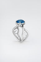 Silver Thorn Ring by Poché featuring a delicate, spiked design, displayed on a neutral background.