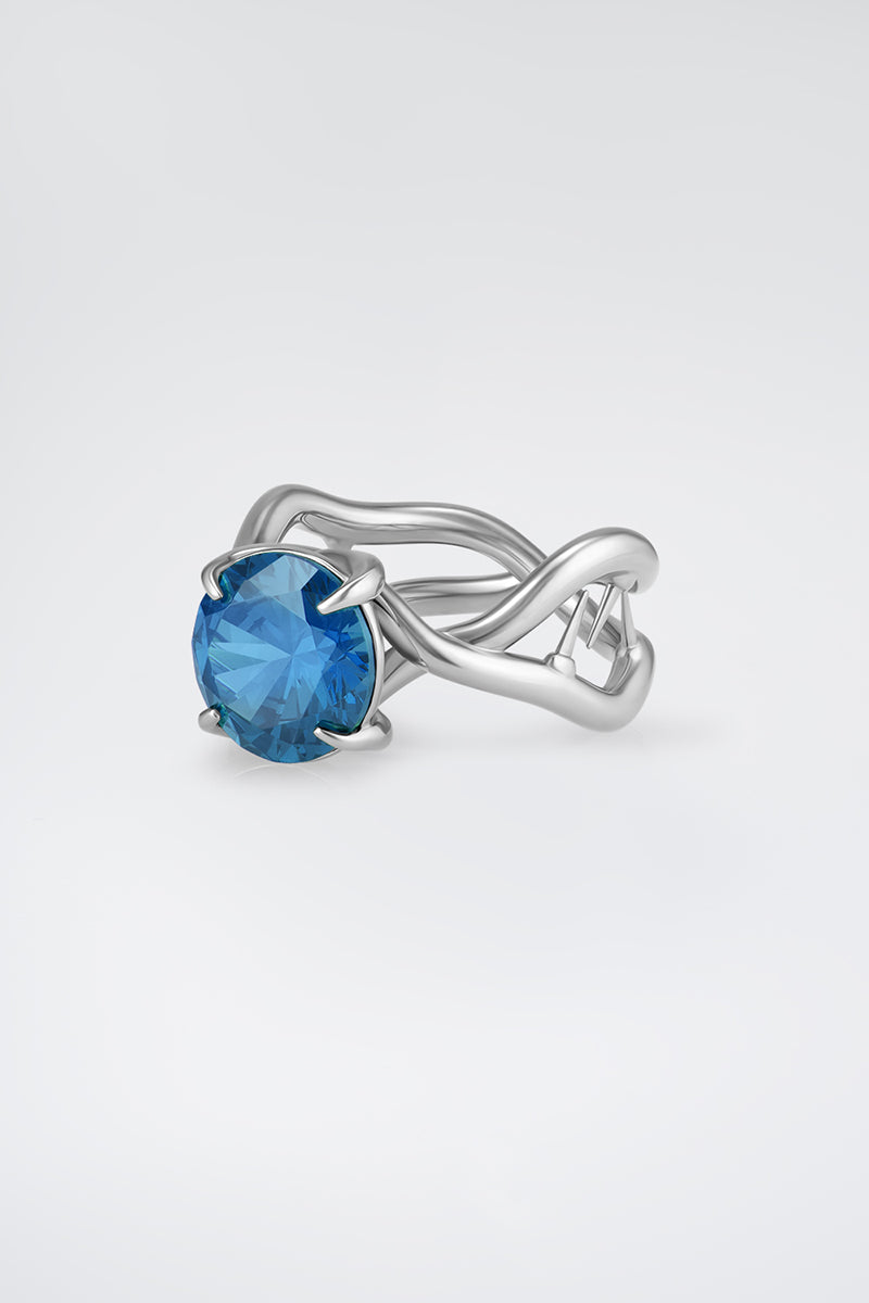 Silver Thorn Ring by Poché featuring a sleek band with a detailed thorn design, perfect for modern jewelry styles.