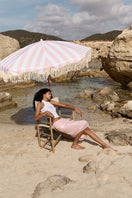 Light pink Ikinita Sunrise Top featuring a relaxed fit and soft fabric, perfect for casual summer wear.