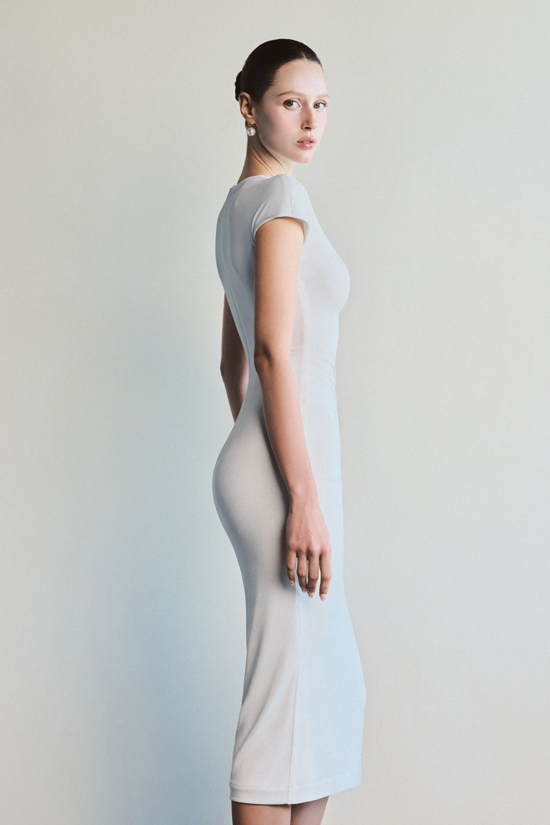 Ivory Ruche White Midi Dress by Le Thanh Hoa, elegant sleeveless dress with ruched fabric and flowy hem for a sophisticated look.