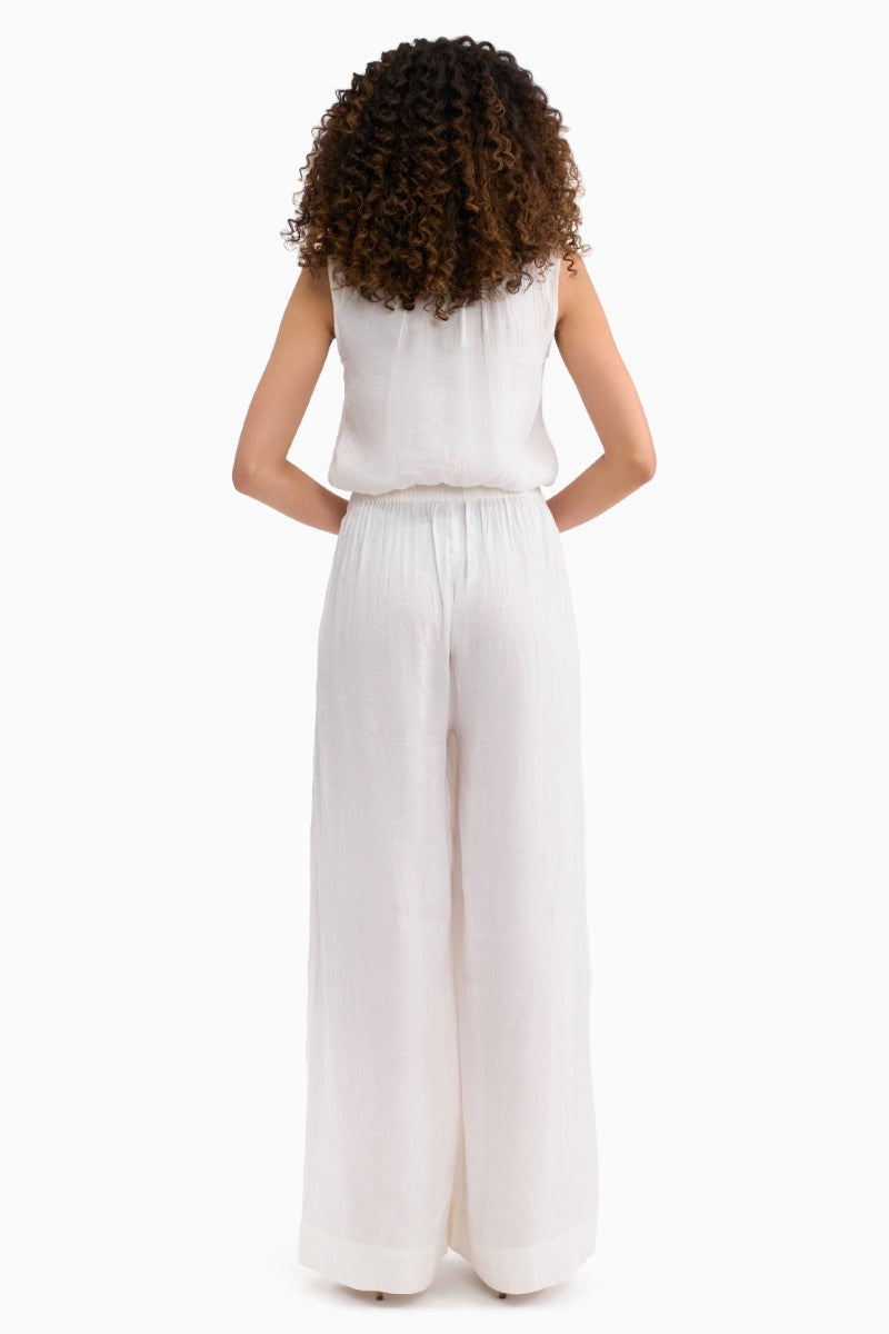 Rebecca Taylor Cleo Pant in ivory, a stylish high-waisted top with tailored fit, shown in a spring fashion image.