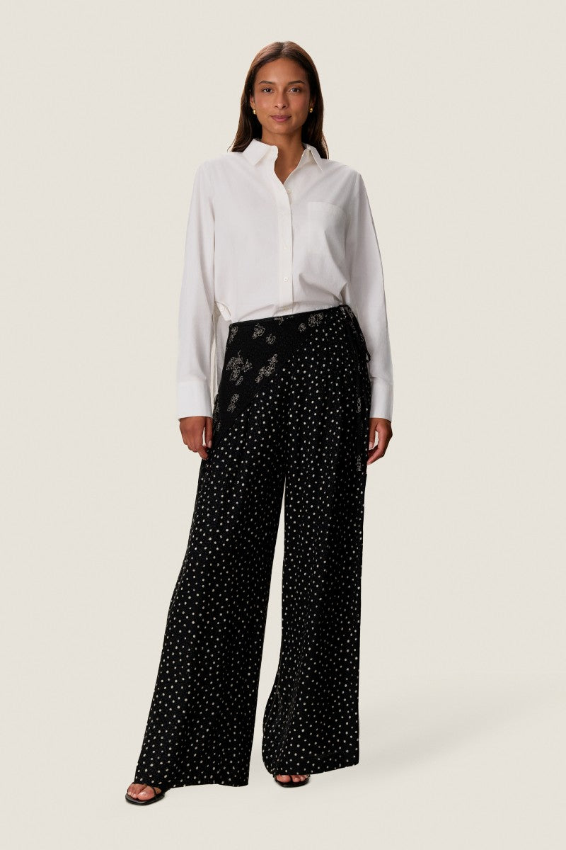 Rebecca Taylor Lauren wrap pants in neutral fabric, featuring a high waist and tailored fit, shown on a model.