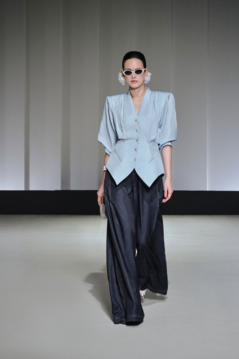 Jenny K Tran Longtown blazer in tailored black fabric, featuring a classic lapel collar and sleek fit.