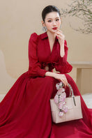 Elegant Scarlet Serenity gown by Do Long, featuring flowing fabric and intricate details, perfect for formal occasions.