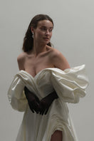 Off-White Volume Sculpted Gown by Monetre featuring a flowing, sculpted silhouette in elegant fabric, perfect for formal occasions.