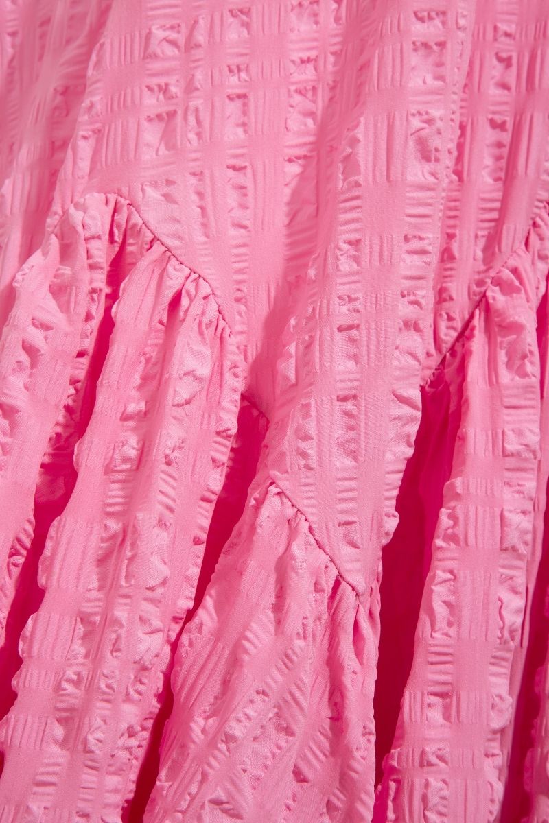Sisters Talia Maxi Dress in Powder Rose, featuring flowing fabric and elegant design, displayed on a hanger.