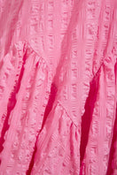 Sisters Talia Maxi Dress in Powder Rose, flowing sleeveless dress with a V-neckline and soft fabric, displayed on a hanger.