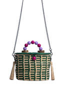 Green Catarina Mina Jirau basket bag with top handle and woven design, stylish accessory for casual and chic outfits.