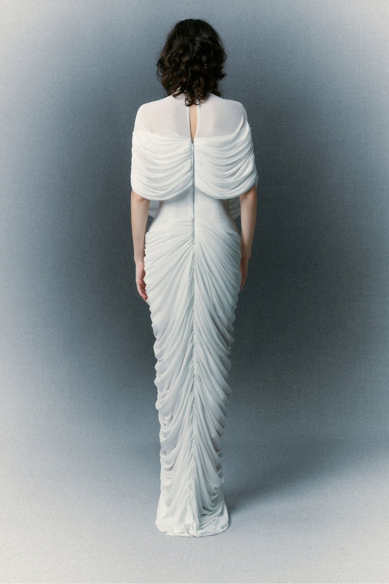 Elegant white gown from White Plan's BRILLIANT DRESS collection, featuring flowing fabric and intricate detailing.