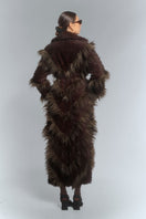 Brown faux fur maxi coat with diagonal panel design by Fortini, showcasing plush texture and stylish, oversized silhouette.